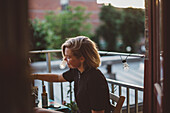 Young woman on balcony