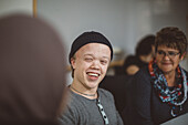 Smiling teenage boy looking away