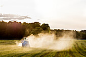 Tractor working in field