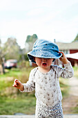 Toddler girl in garden