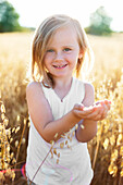 Girl on oat field