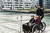 Father with children cycling