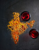 Spices and wineglasses on grey background