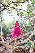 Girl climbing branches