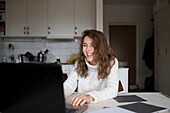 Young woman using laptop