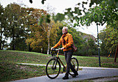 Man pushing bicycle