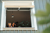 Mother with daughter seen through window