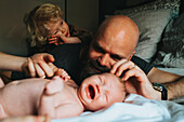 Family on bed