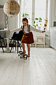 Girl on skateboard at home