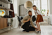 Girl on skateboard at home