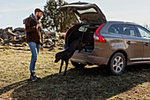 Man standing near car