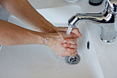 Woman washing hands