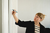 Woman using whiteboard