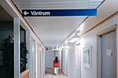 Nurse walking through corridor