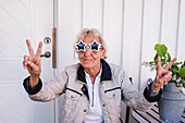 Woman wearing star-shaped sunglasses