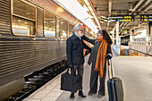 Mature couple on train station platform