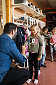 Teacher greeting children