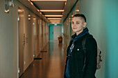 Woman standing in corridor