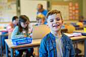 Smiling boy in classroom