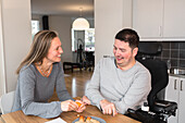 Man and woman talking in kitchen