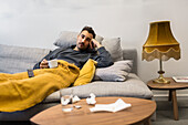 Man relaxing on sofa