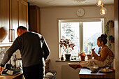 Father and daughter in kitchen