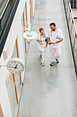 Doctors walking through corridor