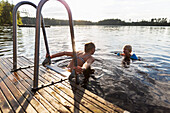 Mother and son in lake