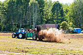 Tractor fertilizing field