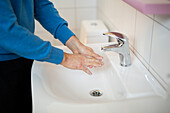 Man wash his hands with soap