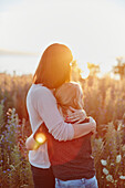 Mother and daughter hugging