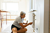 Woman painting walls