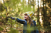 Smiling girl in forest