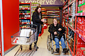 Female carer helping woman with shopping