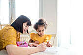 Mother with daughter at home