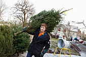 Man carrying Christmas tree