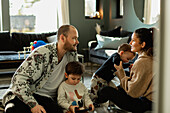 Parents with children in living room