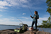 Woman fishing at sea