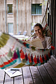 Woman reading on hammock
