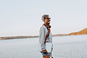 Woman at sea holding laptop