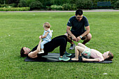 Family exercising in park