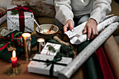 Womans hands wrapping Christmas gift