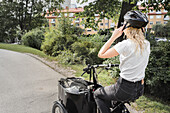 Woman cycling cargo bike