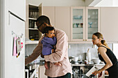 Parents with baby in kitchen