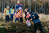 Playschool teachers walking with children