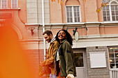 Young couple walking on street