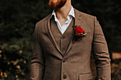 Mid section of groom