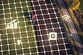 Aerial view of plowed field with computer icons