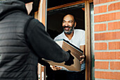 Man having parcels delivered