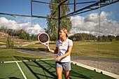 Woman holding padel racket